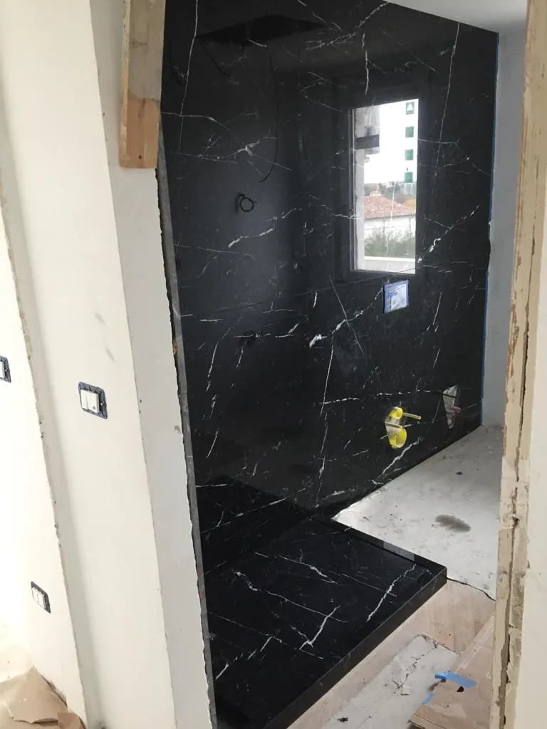 Nero Marquina walls during installation