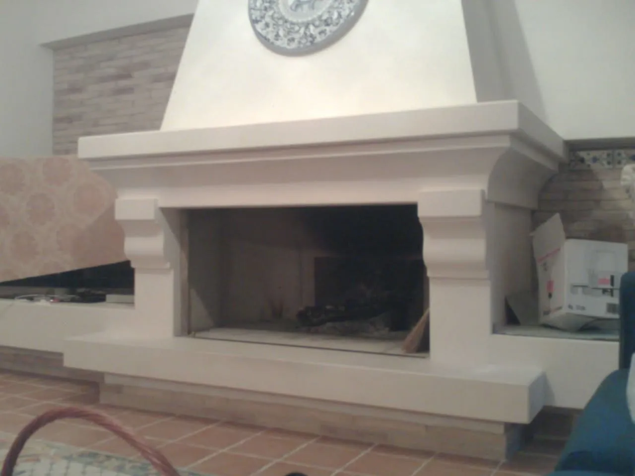 Limestone fireplace with hood