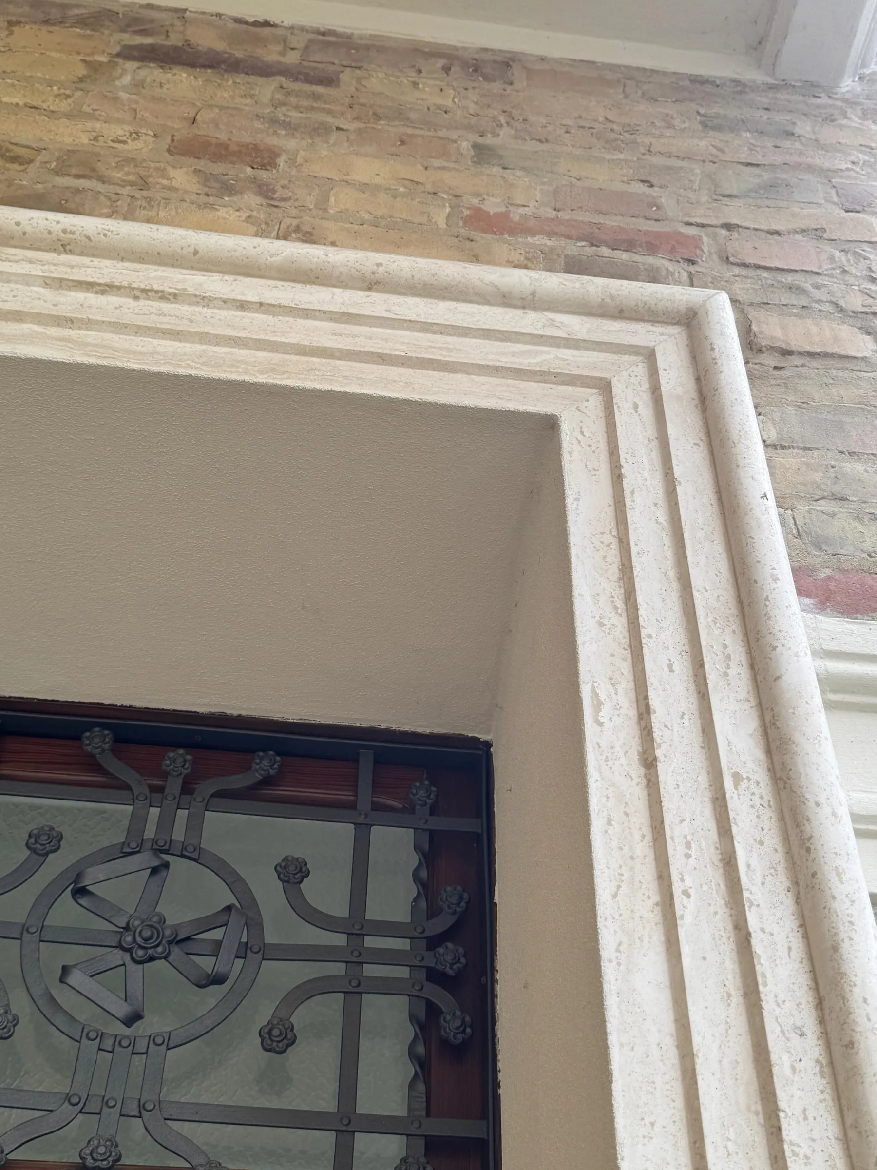 Detail of the portal's travertine surround