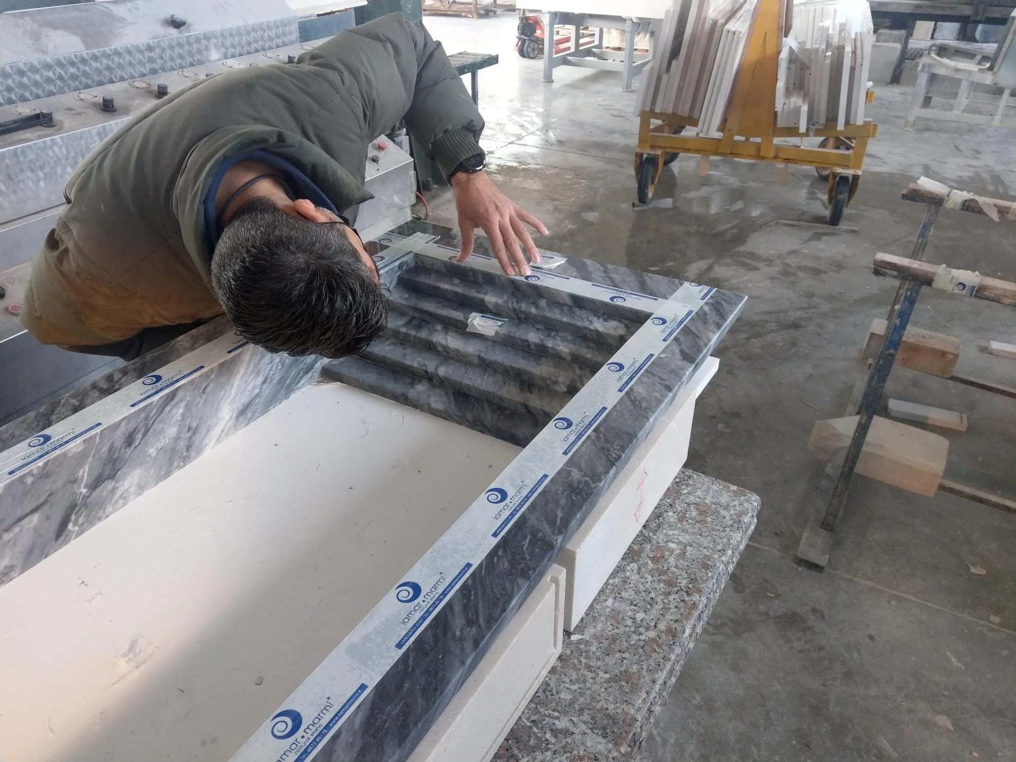 Inspection of a marble stair element before packing